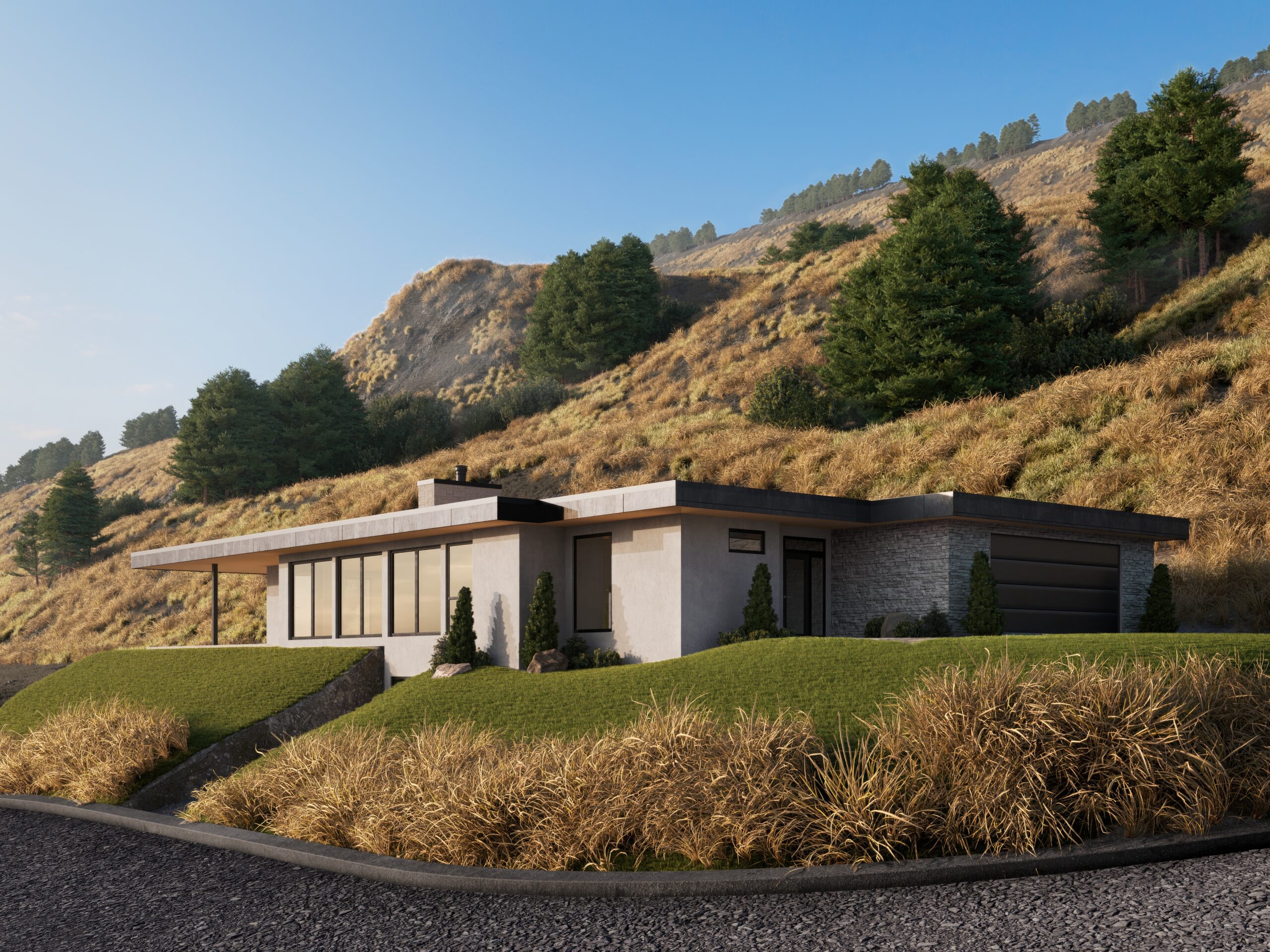 Image of the exterior of a home with green grass and a hillside behind. The house has many windows, a flat roof and an attached garage.